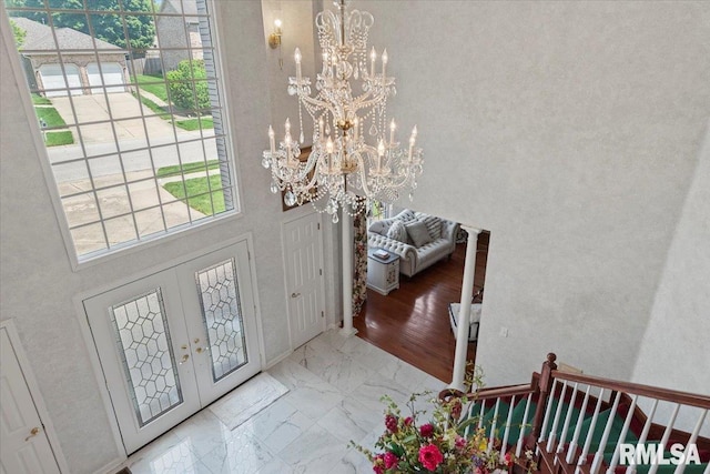 505 Clipper Rd, Springfield, IL 62704 - foyer with a chandelier, marble look tiles, and a high ceiling