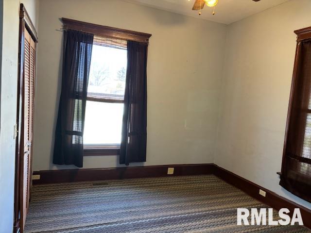 412 Pine St, Greenfield, IL 62044 - unfurnished room with carpet, a ceiling fan, and baseboards