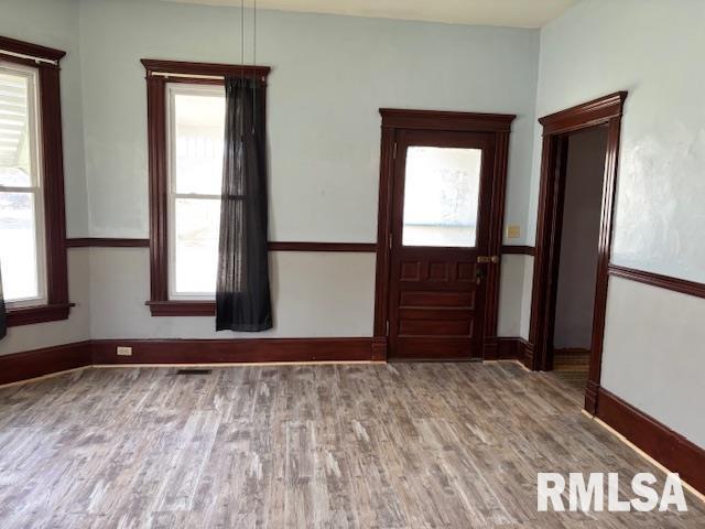 412 Pine St, Greenfield, IL 62044 - foyer entrance with wood finished floors, plenty of natural light, and baseboards