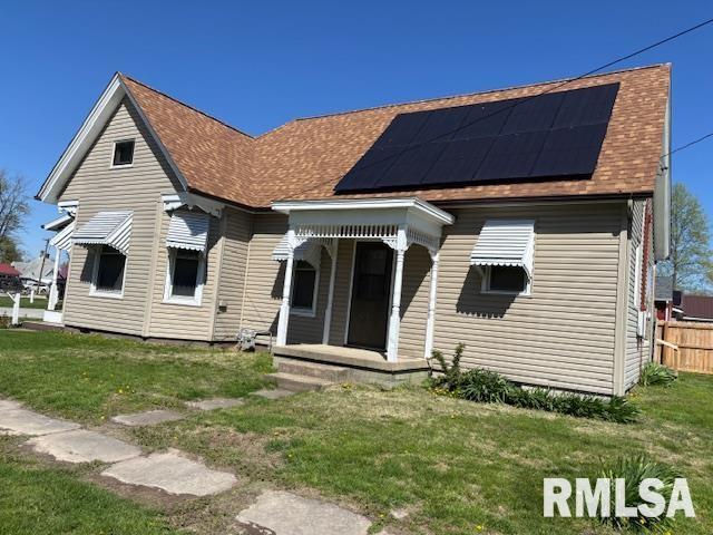 412 Pine St, Greenfield, IL 62044 - back of house with roof with shingles and roof mounted solar panels