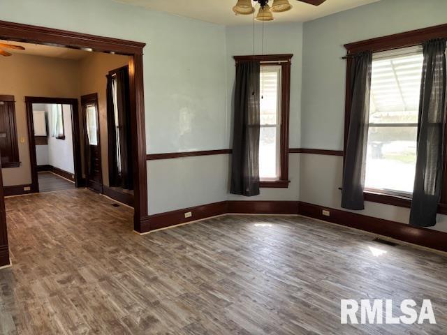 412 Pine St, Greenfield, IL 62044 - spare room with a ceiling fan, wood finished floors, and baseboards