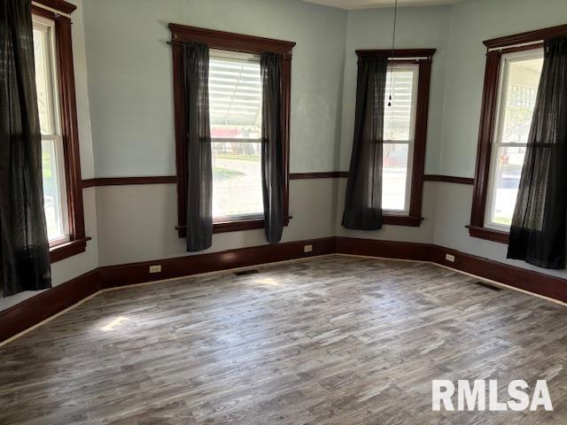 412 Pine St, Greenfield, IL 62044 - empty room with wood finished floors and baseboards