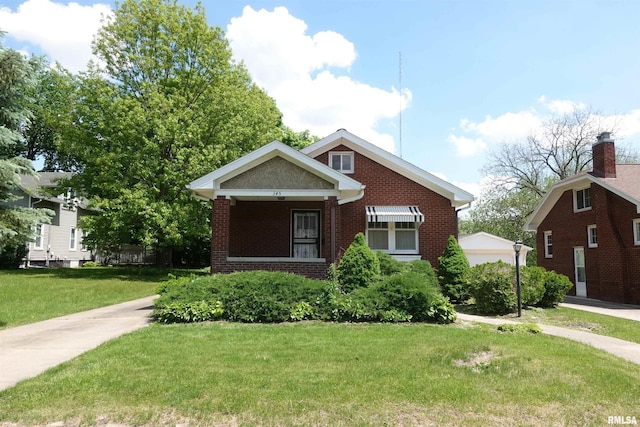 345 Division St, Galesburg, IL 61401 - view of front of property with brick siding and a front yard