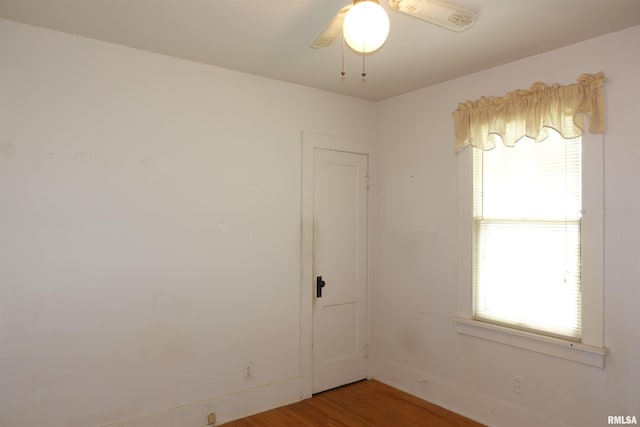 345 Division St, Galesburg, IL 61401 - unfurnished room with wood finished floors, ceiling fan, and baseboards