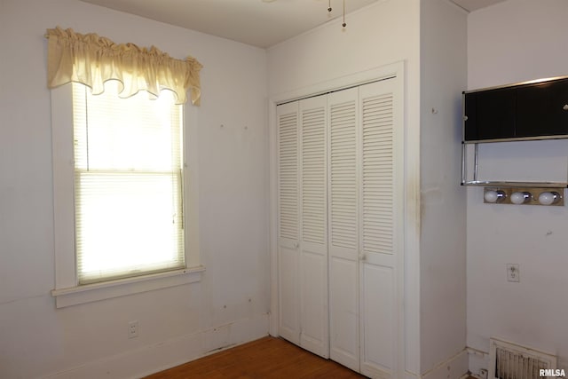 345 Division St, Galesburg, IL 61401 - unfurnished bedroom featuring a closet and wood finished floors