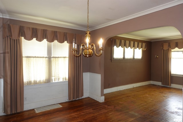 345 Division St, Galesburg, IL 61401 - empty room with arched walkways, a chandelier, hardwood / wood-style floors, ornamental molding, and baseboards