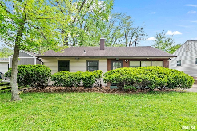 2330 Dover St, Springfield, IL 62703 - view of front of house featuring a chimney, a front yard, and a shingled roof