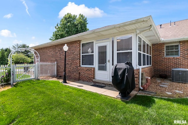 5021 Wildcat Run, Springfield, IL 62711 - view of property exterior featuring brick siding, a gate, central AC unit, and roof with shingles