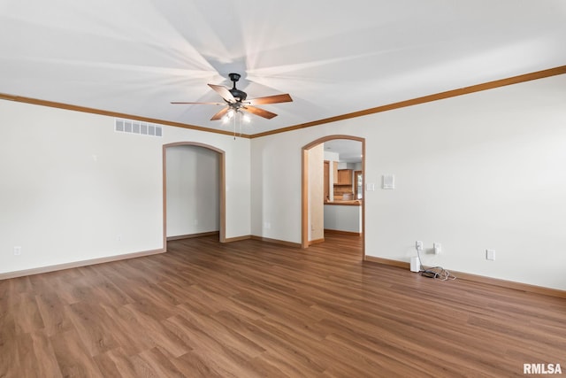 5021 Wildcat Run, Springfield, IL 62711 - empty room with arched walkways, ceiling fan, wood finished floors, baseboards, and ornamental molding