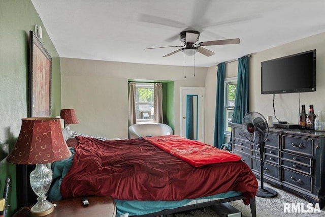 carpeted bedroom featuring a ceiling fan