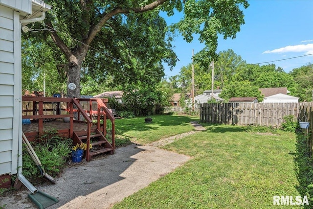 view of yard with a wooden deck