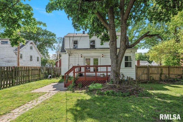 back of house with a deck and french doors
