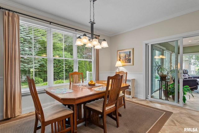 1625 Grace Ridge Rd, New Berlin, IL 62670 - dining area with a chandelier, a wainscoted wall, and crown molding