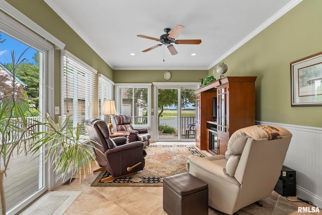 1625 Grace Ridge Rd, New Berlin, IL 62670 - living room with healthy amount of natural light, ceiling fan, ornamental molding, tile patterned floors, and a wainscoted wall