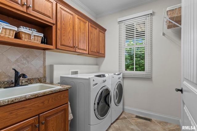 1625 Grace Ridge Rd, New Berlin, IL 62670 - washroom with cabinet space, washing machine and clothes dryer, ornamental molding, baseboards, and light tile patterned floors