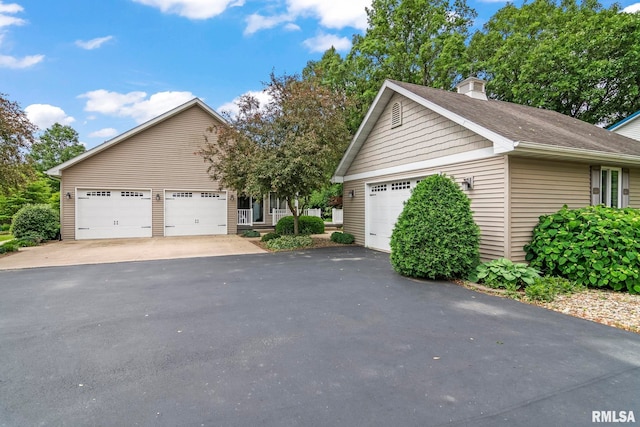 1625 Grace Ridge Rd, New Berlin, IL 62670 - view of front of property with a garage, a chimney, and roof with shingles