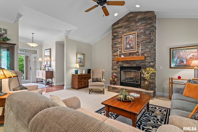 1625 Grace Ridge Rd, New Berlin, IL 62670 - living room featuring a ceiling fan, crown molding, baseboards, a stone fireplace, and light colored carpet