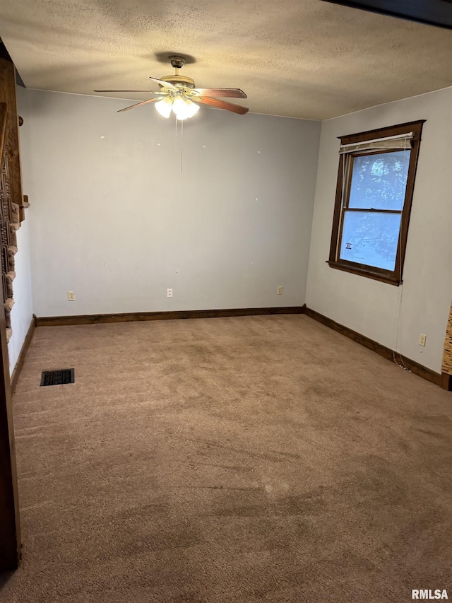 1205 E Converse Ave, Springfield, IL 62702 - carpeted spare room with a ceiling fan, a textured ceiling, and baseboards