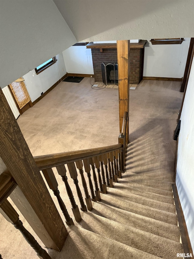 1205 E Converse Ave, Springfield, IL 62702 - stairs featuring carpet, a brick fireplace, baseboards, and vaulted ceiling