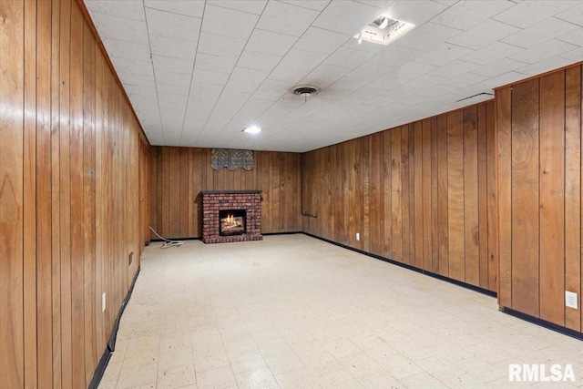 1816 S Street Ct, Springfield, IL 62703 - finished below grade area with a brick fireplace, wood walls, and light floors