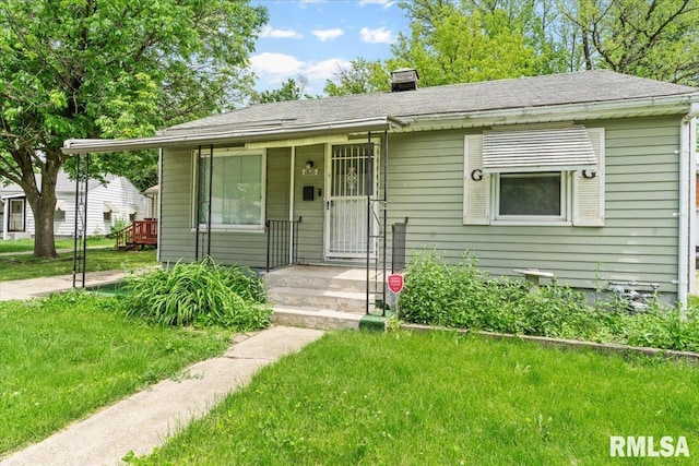 1816 S Street Ct, Springfield, IL 62703 - bungalow with a front lawn, a shingled roof, and a chimney