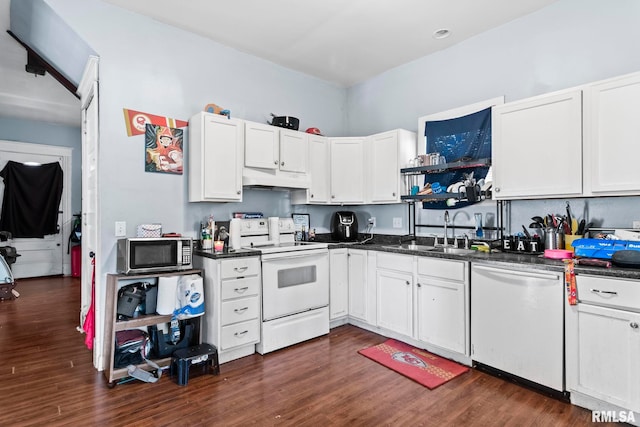 108 S Macarthur Blvd, Springfield, IL 62704 - kitchen with appliances with stainless steel finishes, a sink, under cabinet range hood, and dark countertops