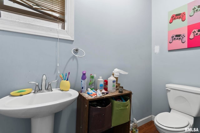 108 S Macarthur Blvd, Springfield, IL 62704 - bathroom featuring a sink, toilet, and wood finished floors