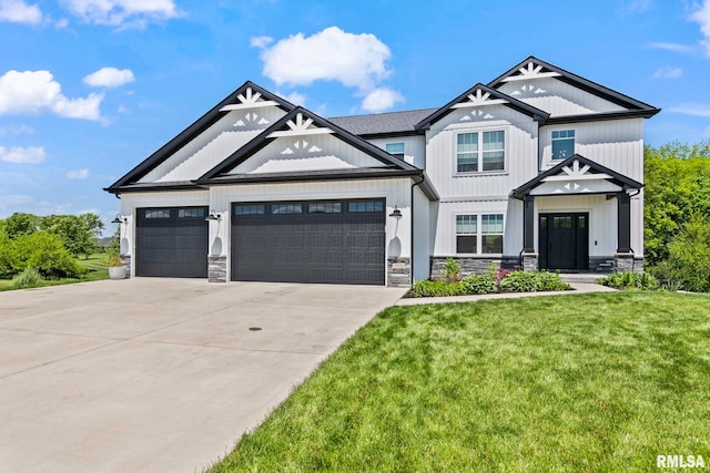 1915 Parthenon Ct, Chatham, IL 62629 - view of front facade with a garage, concrete driveway, a front lawn, and stone siding