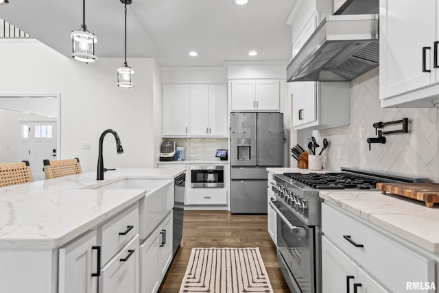 1915 Parthenon Ct, Chatham, IL 62629 - kitchen with stainless steel appliances, wall chimney exhaust hood, a sink, white cabinetry, and decorative backsplash