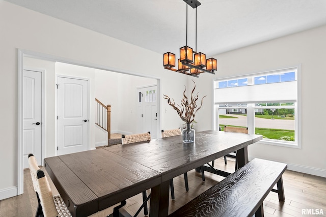 1915 Parthenon Ct, Chatham, IL 62629 - dining area featuring a chandelier, plenty of natural light, stairs, and baseboards