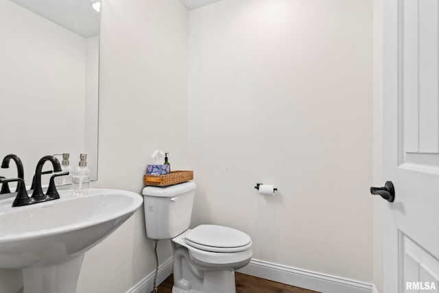1915 Parthenon Ct, Chatham, IL 62629 - half bath with baseboards, wood finished floors, toilet, and a sink