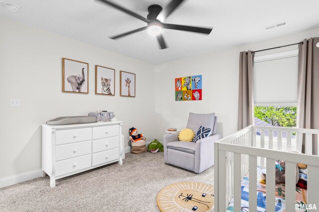 1915 Parthenon Ct, Chatham, IL 62629 - bedroom with a crib, carpet floors, baseboards, and a ceiling fan