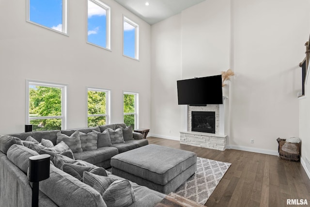 1915 Parthenon Ct, Chatham, IL 62629 - living area with a high ceiling, dark wood finished floors, a fireplace, and baseboards