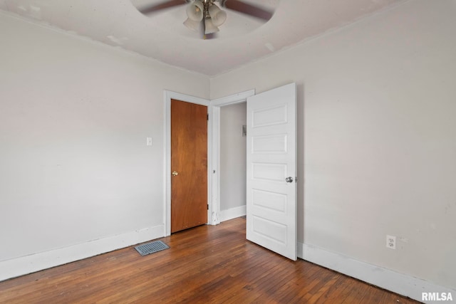 unfurnished bedroom with baseboards, hardwood / wood-style flooring, and ceiling fan