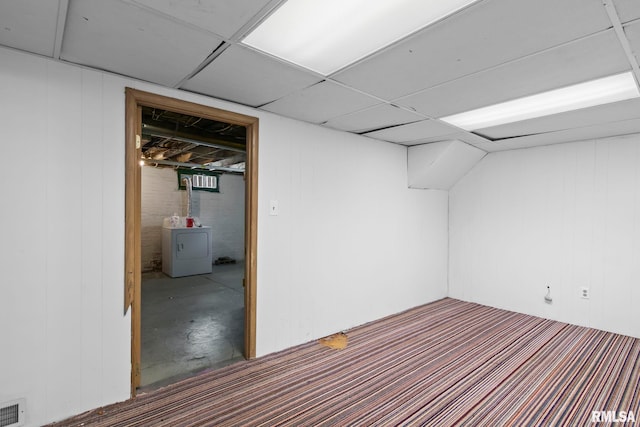 finished basement featuring washer / clothes dryer