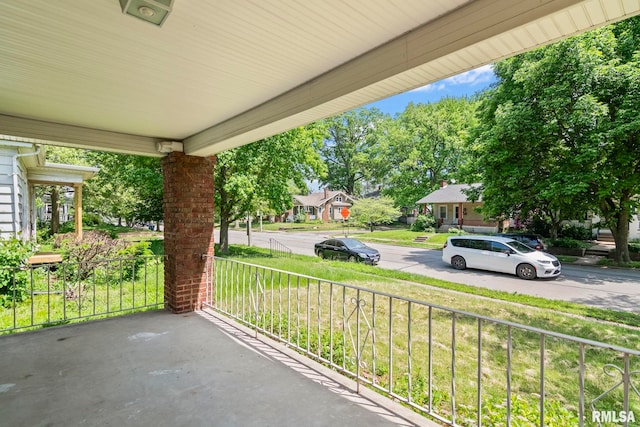 view of patio / terrace featuring covered porch and a residential view