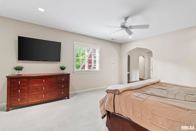 bedroom with carpet floors, baseboards, arched walkways, recessed lighting, and a ceiling fan