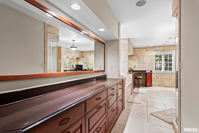 bar area featuring recessed lighting, hanging light fixtures, and light tile patterned floors