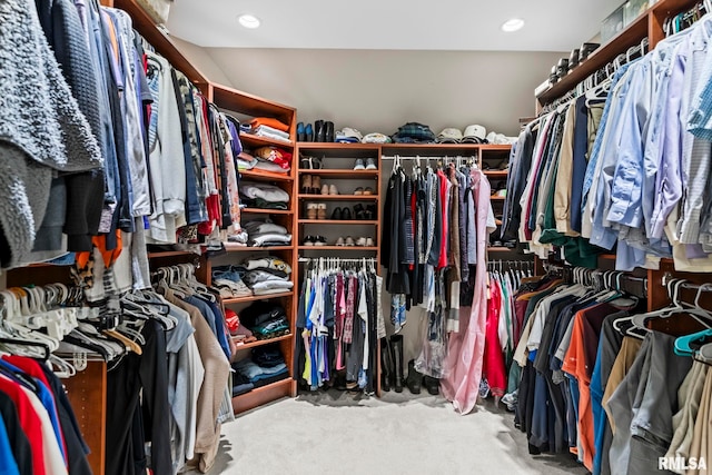 walk in closet featuring carpet