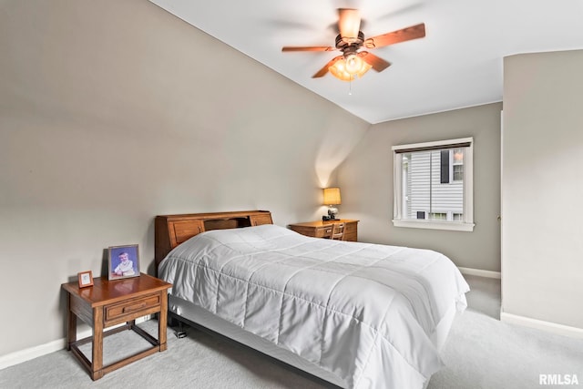 carpeted bedroom with baseboards and a ceiling fan