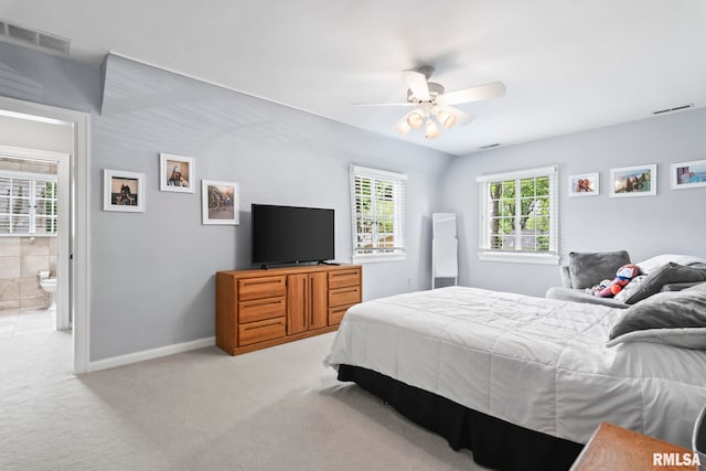 bedroom with light carpet, baseboards, and ceiling fan