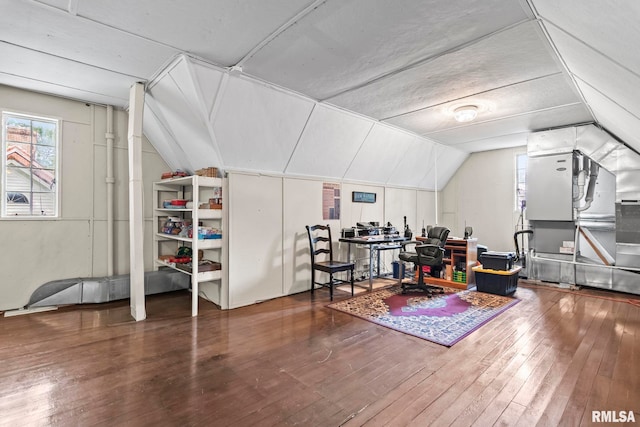 home office featuring vaulted ceiling and hardwood / wood-style flooring