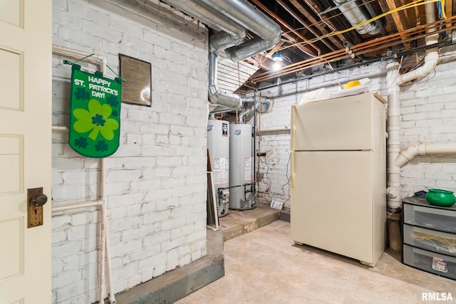 unfinished basement featuring freestanding refrigerator and water heater