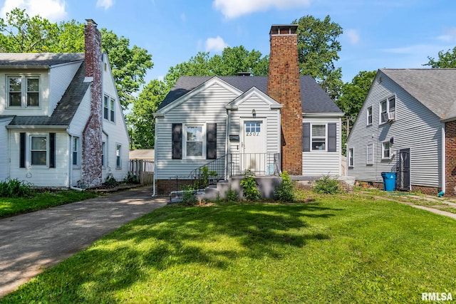 2501 S Lowell Ave, Springfield, IL 62704 - bungalow-style home with a chimney and a front lawn
