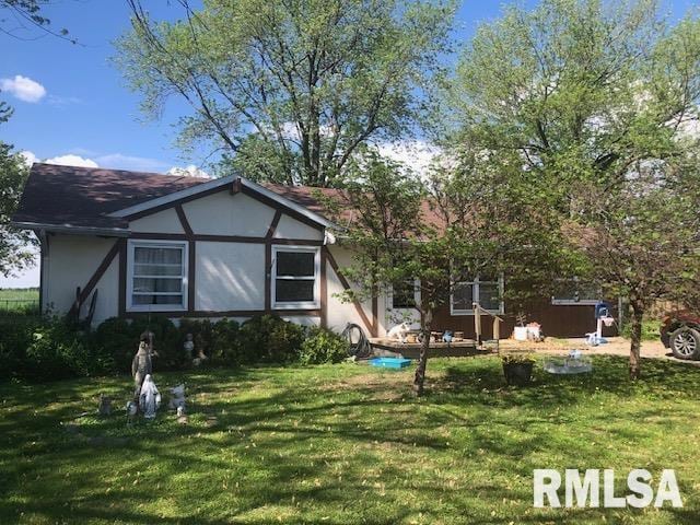 101 Cottage Ln, Murrayville, IL 62668 - view of front of house featuring a front lawn and stucco siding