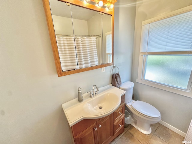 103 N Ohio Ave, Abingdon, IL 61410 - bathroom with vanity, toilet, tile patterned floors, a shower with curtain, and baseboards