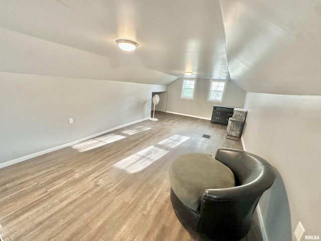 103 N Ohio Ave, Abingdon, IL 61410 - sitting room with light wood-style flooring, lofted ceiling, and baseboards