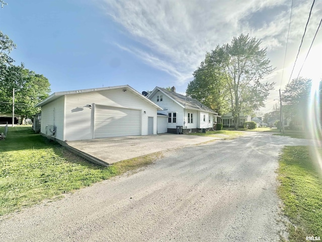 103 N Ohio Ave, Abingdon, IL 61410 - view of property exterior with driveway and an outdoor structure