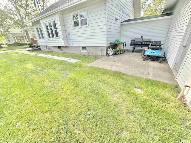 103 N Ohio Ave, Abingdon, IL 61410 - view of side of home featuring a yard and a patio area