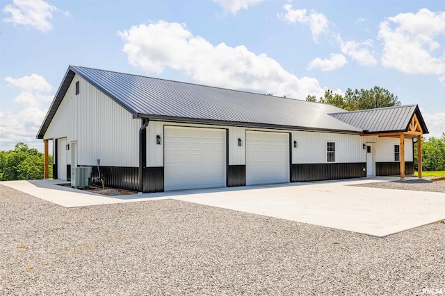 142 Oak Rd, Harrisburg, IL 62946 - view of side of property featuring metal roof and central air condition unit